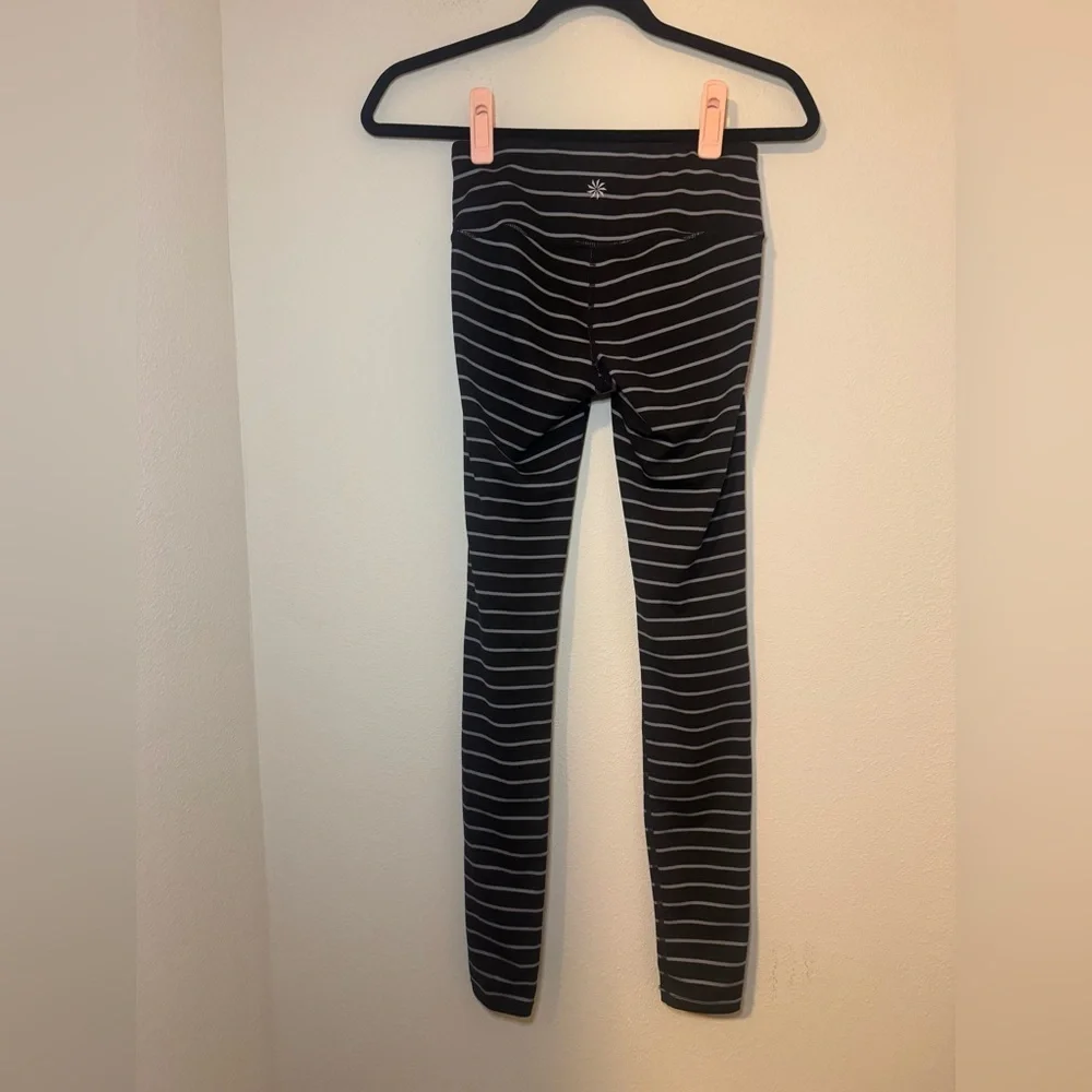 Athleta Chaturanga tight leggings in a black and gray striped pattern